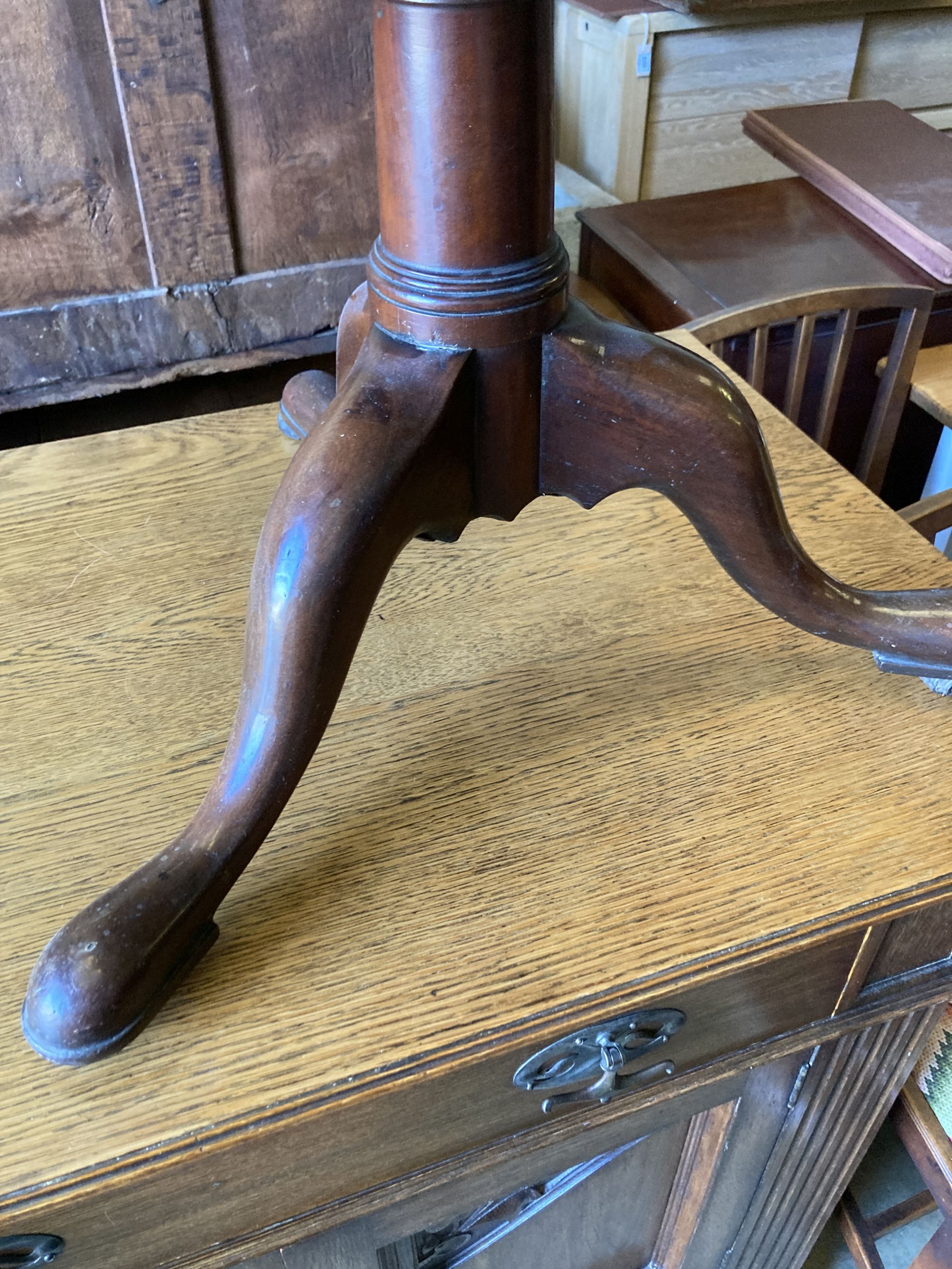 A 19th century mahogany three tier circular dumb waiter, with dish top on tripod base, height 106cm